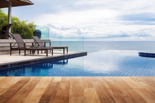 Wood Table Top On Beach Chair In Outdoor With Swimming Pool And Sea View Andaman Sea.