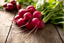 Fresh Red Radish On Wooden Table.