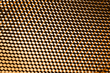 abstract texture honeycomb. Metallic net background or texture. metal mesh. full frame colourful illuminated detail of a metallic grid in front of a loudspeaker