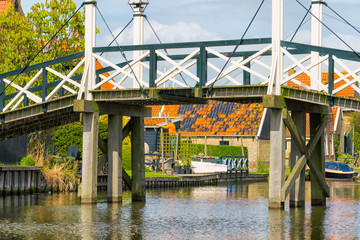 Fototapete - Historic wooden bridge in Hindeloopen. The Netherlands
