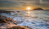 Fototapeta Big Ben - Sunset at Godrevy lighthouse with sea