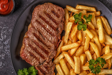 Wall Mural - Beef barbecue steak with french fries.