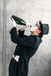 © Nomad_Soul - Mime actor drinking from a big bottle