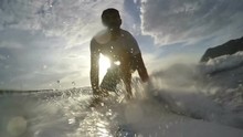Slow Motion Of A Surfer Take Off At Sunset