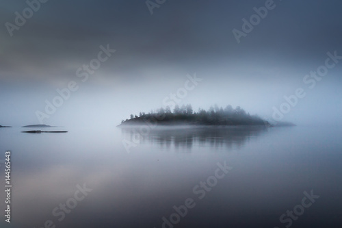 The island is in a fog. Kar...