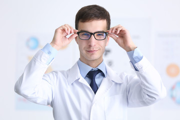 Wall Mural - Handsome young ophthalmologist in clinic