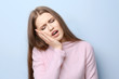 © Africa Studio - Young woman suffering from toothache on light background