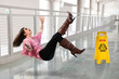 Woman Falling on Wet Floor