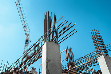 Steel Frames of A Building Under Construction, With Tower Crane On Top