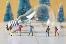 Miniature Photographer Take A Picture Of Vintage Light Bulb