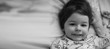© alexkich - Black and white photo portrait of a young child lying on a pillo