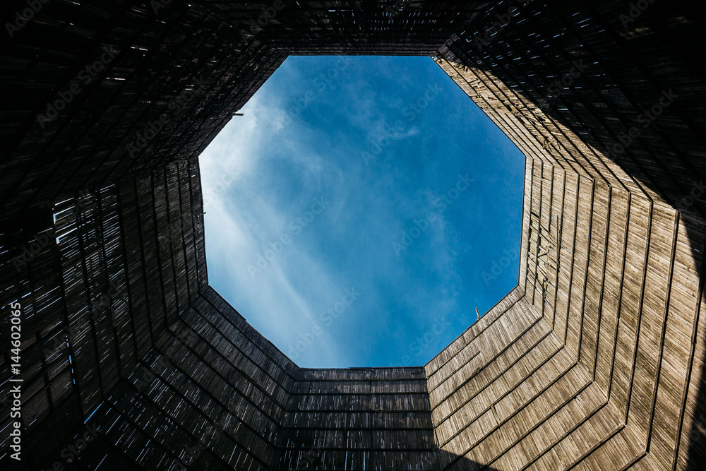 A view of the cloudy sky from inside the power plant cooling towers ...
