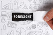 © Egor - Business, Technology, Internet and network concept. Young businessman shows the word: Foresight