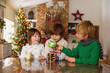 © RooM The Agency - Three children drinking hot chocolate at Christmas