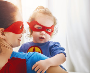 Girl and mom in Superhero costume