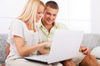 © Svetlana - Young couple using laptop.