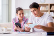 © Elnur - Young family discussing family finances