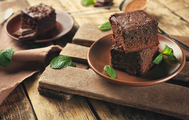 Canvas Print - Plate with delicious cocoa brownies on wooden table