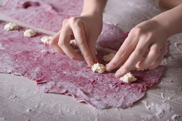 Canvas Print - Woman making ravioli on table