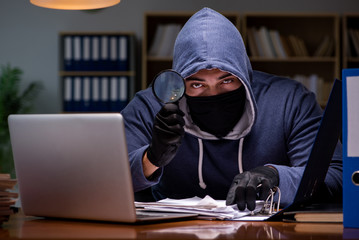 hacker stealing personal data from home computer