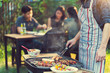 © torwaiphoto - Asian men are cooking for a group of friends to eat barbecue