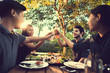 © torwaiphoto - People in asian are celebrating the festival they clink beer and dinner outdoor they are happy