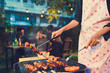 Asian woman are cooking for a group of friends to eat barbecue