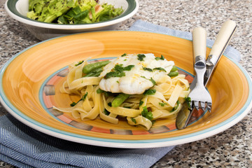 Wall Mural - steamed cod with butter lemon sauce and tagliatelle