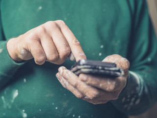 Painter using smartphone