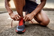 © fotokitas - Man tying running shoes