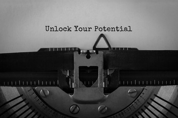 Wall Mural - text unlock your potential typed on retro typewriter