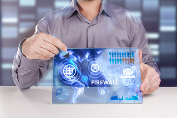 Business, Technology, Internet and network concept. Young businessman working on a virtual screen of the future and sees the inscription: Firewall