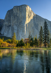 Wall Mural - Mountain reflected in lake at sunrise