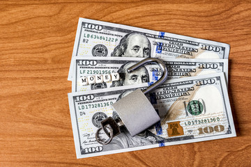 dollar currency notes with lock and chain. money stack for safety and investment.