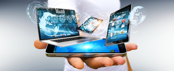 Aufkleber - Businessman connecting tech devices with his mobile phone 3D rendering