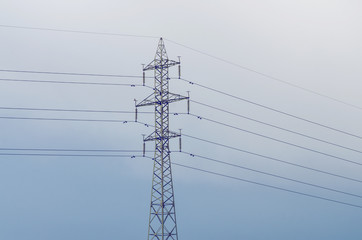 Electricity Pylon Line In Blue Sky With Cloud