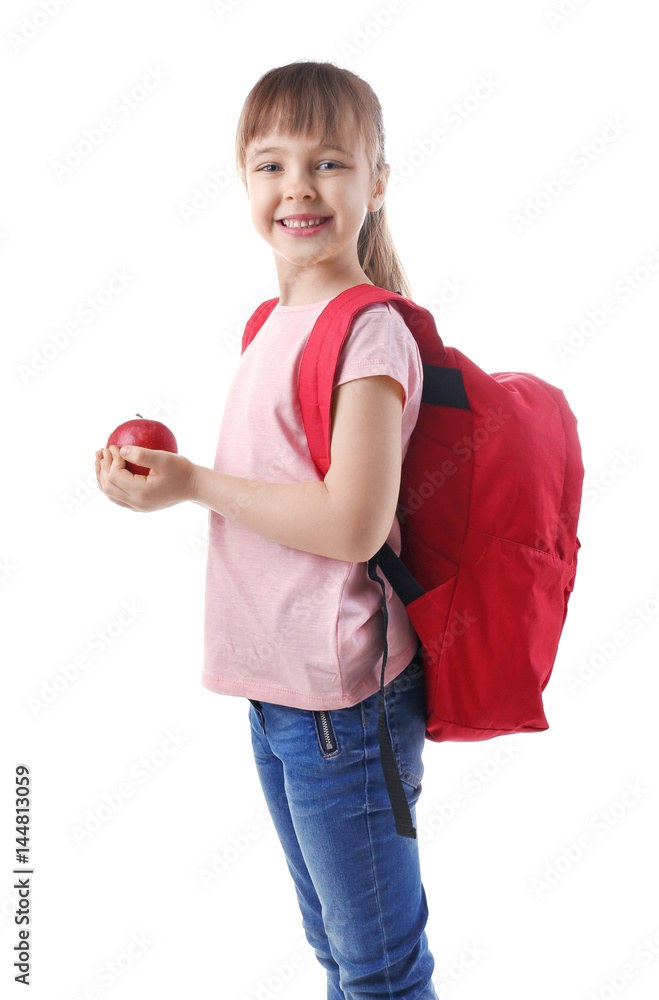 Happy schoolgirl with backpack and apple on white background
