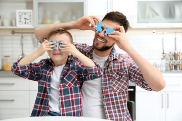 Canvas Print - Father playing with his son at home