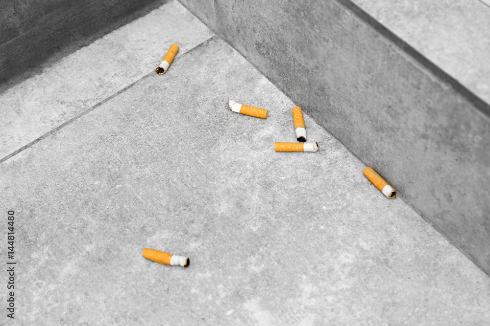 Cigarette butts on tile