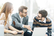 © yurolaitsalbert - managers of the company and the client, discussing the terms of the new contract and look at the laptop screen with the correct information.