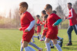 © Dusan Kostic - Kids soccer football - children players exercising before match on soccer field