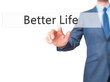 Better Life - Businessman hand pressing button on touch screen interface.