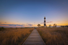 Boardwalk Leading To Bodie Island Lighthouse At Sunset 