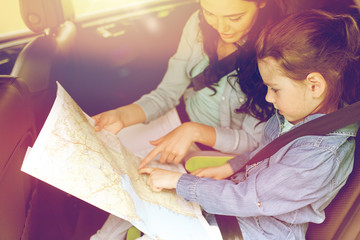 Poster - happy family with travel map driving in car