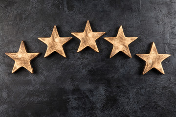 Five stars on dark background