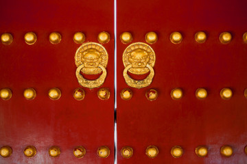 Canvas Print - Chinese gate red doors with golden dragon heads knockers