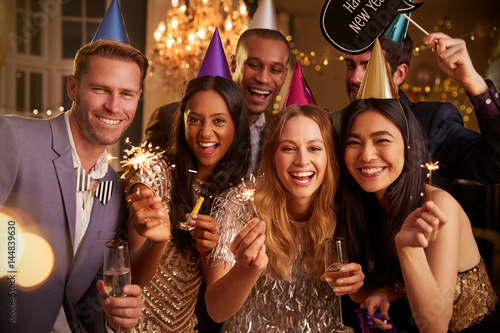 Photo Group Of Friends Celebrating At New Year Party Together