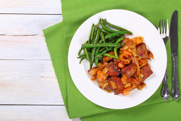 Canvas Print - meat stew with vegetables on plate