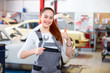 Female mechanic in car service station