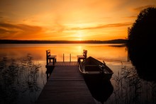 Sunset Over The Fishing Pier At The Lake In Finland